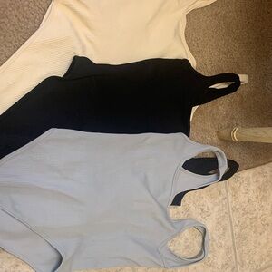 3 Ribbed Bodysuits- Black, White, and Light gray